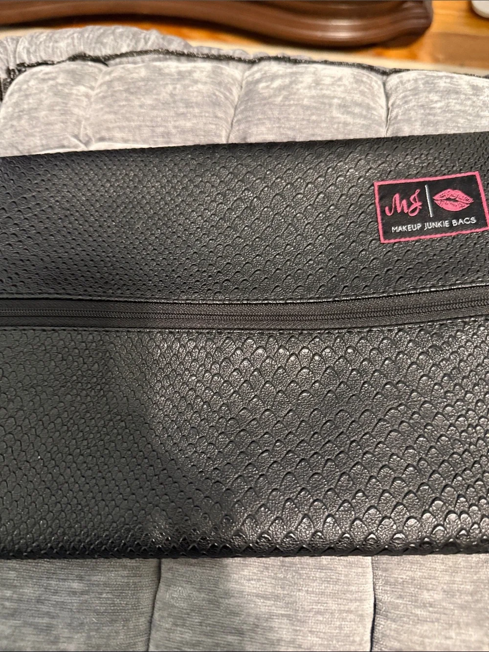 Makeup Junkie Black Cosmetic Bag with Pink Tassel